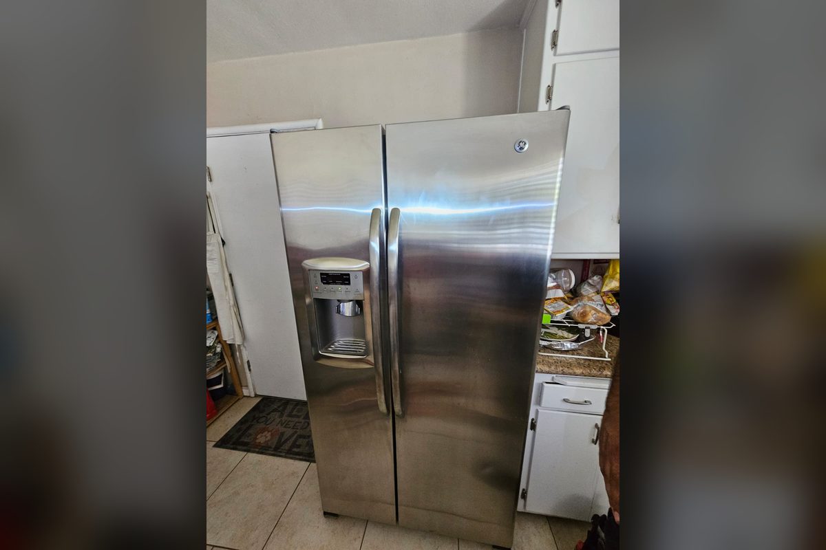 GE side-by-side refrigerator and freezer at a repair call by Appliance Repair Indio, CA