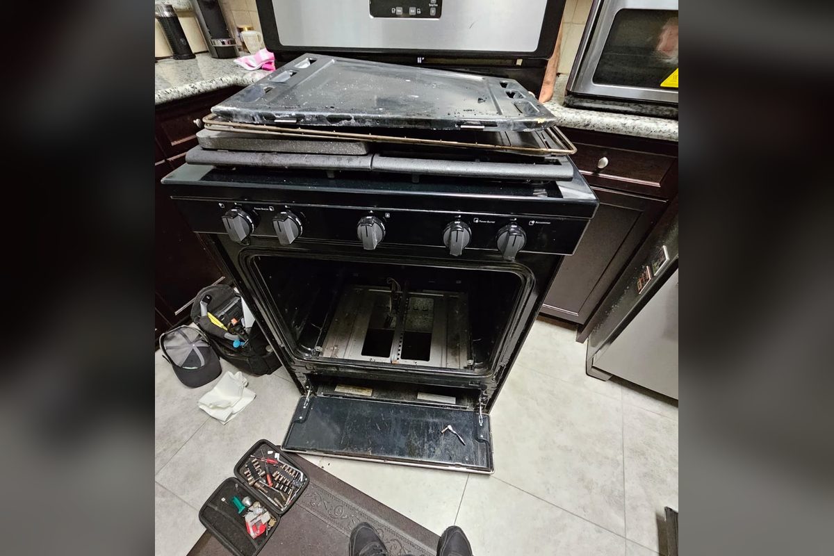 Gas range taken apart during an oven repair by Appliance Repair Indio, CA